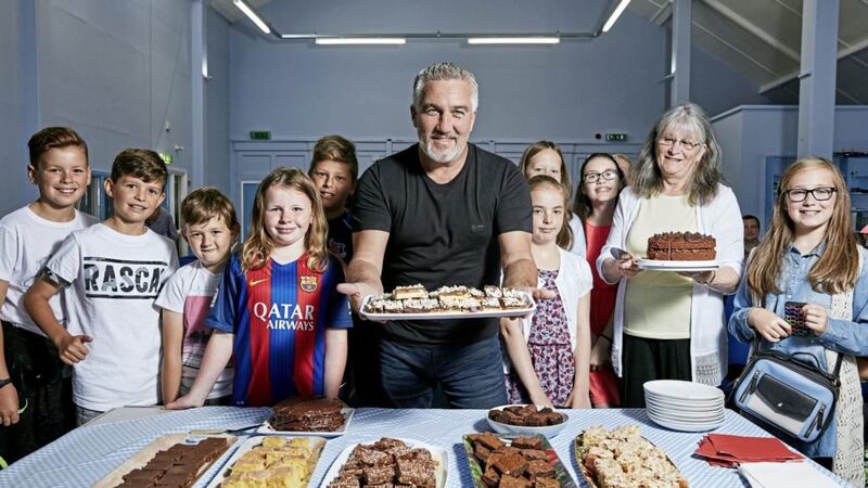 Paul Hollywood at Hebron Evangelical Church with community member Joan and children from the congregation in Paul Hollywood: A Baker&#39;s Life 
