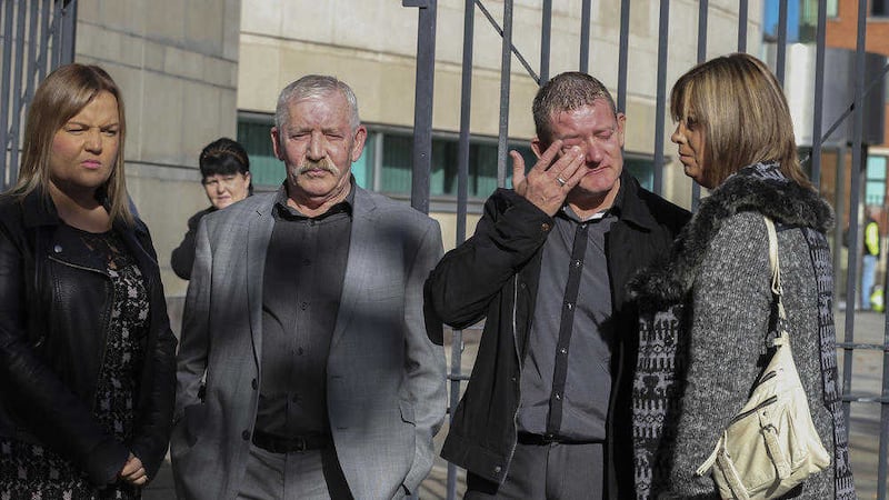 Daniel McColgan's brother Eamon weeps outside Laganside court standing with Daniel's father Uel and his partner at the time of his murder Lyndsey Millliken (left). Picture by High Russell