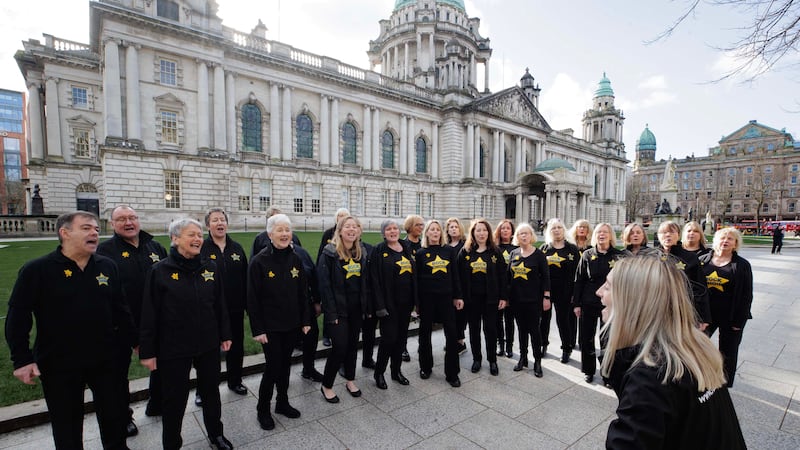 EDITORIAL USE ONLY
A surprise choir performance hosted by End-of-life care charity Marie Curie Belfast City Hall, Northern Ireland. Issue date: Thursday February 29, 2024. PA Photo. Pop-up performances are taking place across the UK as the nation counts down to the Day of Reflection on Sunday March 3, to offer the public a space to take a moment, stop, reflect, and remember the people who died during the pandemic and those who were bereaved. Photo credit should read: Liam McBurney/PA Wire