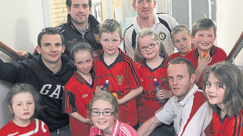 Former Down players Danny Hughes, Benny Coulter and current player Kevin McKernan pictured in 2012 with Ulster Council coach MacCartan McKenna and some of the children from the Newry Mitchel&rsquo;s club who attended the &lsquo;Let&rsquo;s Get Started Programme&rsquo; at Abbey Grammar School. The club of Down legend Sean O&rsquo;Neill, which enjoyed its heyday in the early 60s, is currently struggling to stay afloat&nbsp;