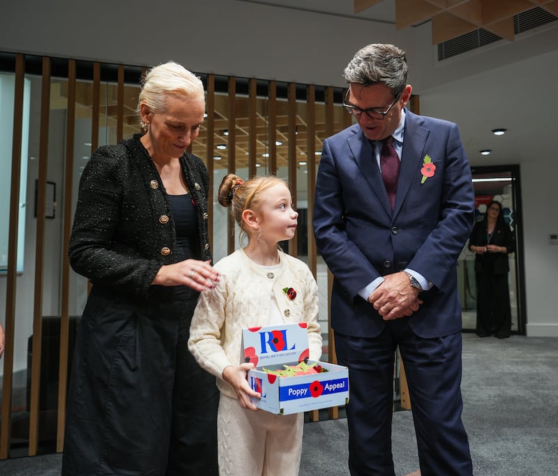 Prime Minister Andy Burnham and his wife Marie France Van Heel speak to Ivy Knighton-Leake, six, one of the UK’s youngest collectors, at No 10 North in Manchester
