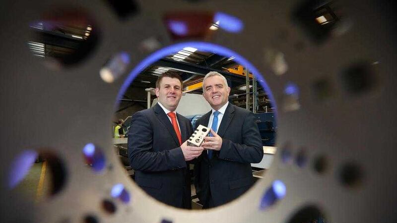 Enterprise Minister Jonathan Bell and Mark Hutchinson announce Hutchinson Group&rsquo;s plans to create 80 new jobs at the group's Kilrea and Antrim sites. Picture by Kelvin Boyes, Press Eye