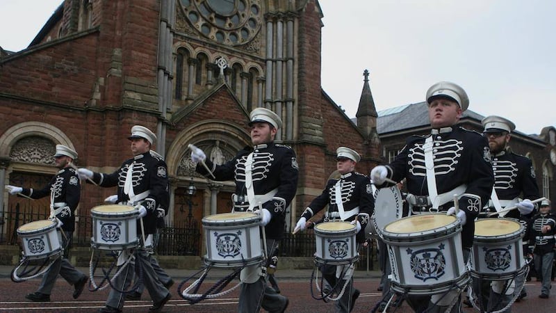 A feeder parade passes by St Patrick&#39;s Church on Donegall Street to a single drum beat.  Picture by Matt Bohill 