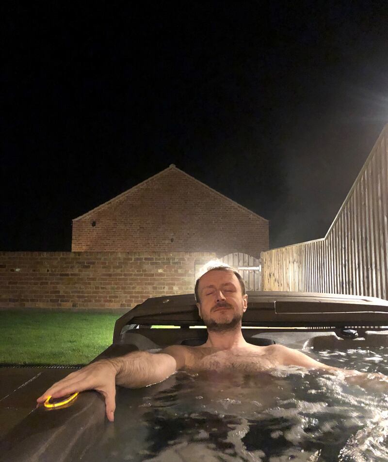 Damon Smith relaxing in a private hot tub at Lincolnshire Coastal Cottages