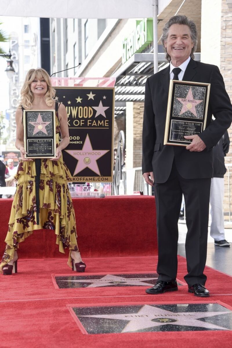 Russell and Hawn by their stars (Richard Shotwell/AP)