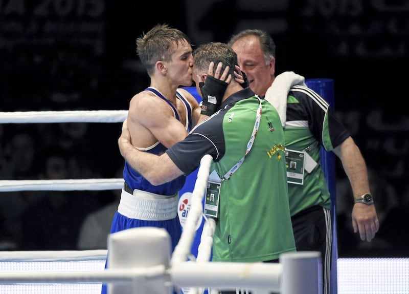 Michael Conlan kisses Billy Walsh on the head after becoming the first Irishman to win a World Championship gold medal in 2015. Picture by Sportsfile 