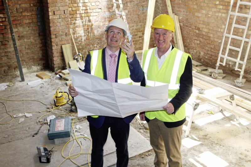 David Crowe and Kevin Baird look at the plans for their new EasyHotel. Picture by Matt Bohill 