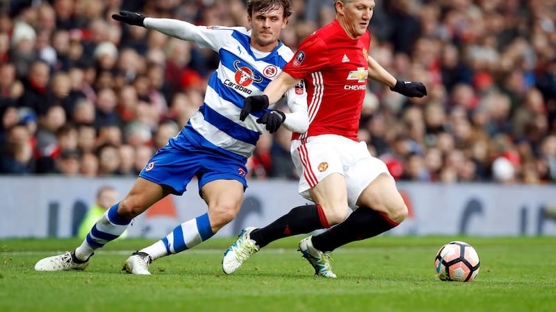 Manchester United's Bastian Schweinsteiger (right) and Reading's John Swift battle for the ball during the Emirates FA Cup&nbsp;
