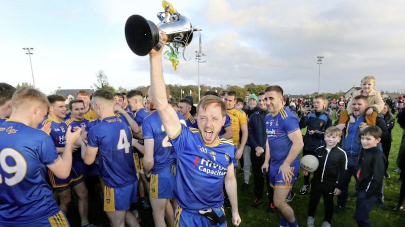 Steelstown Brian Og&#39;s captain Neil Forester lifts the cup and roars with delight at club members after beating Greenlough in the Derry Intermediate Football Championship Final played at Ballymaguigan Picture: Margaret McLaughlin. 