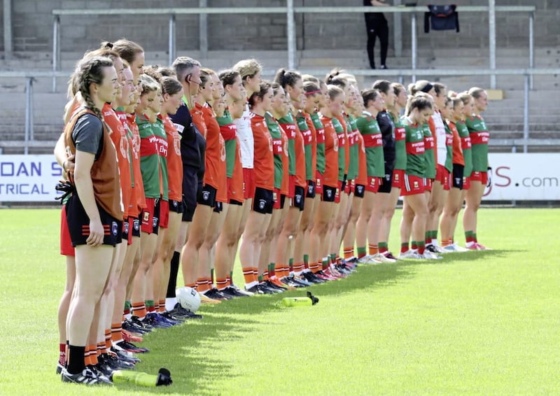 Armagh and Mayo players in a sign of solidarity before their TG4 All-Ireland Senior Championship match at the BOX-IT Athletic Grounds, Armagh Picture: Philip Walsh 