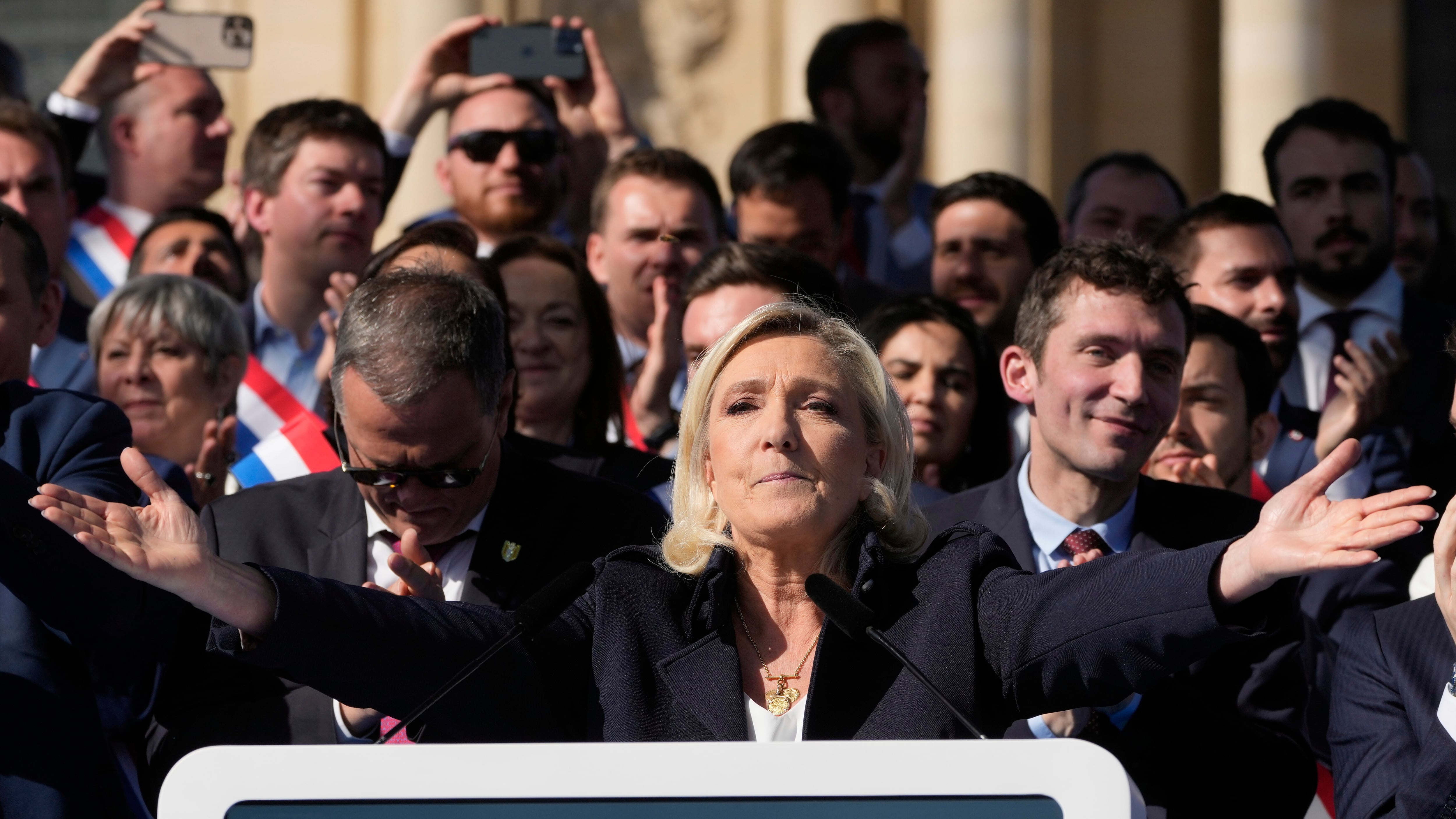 Marine Le Pen delivers her speech during the rally in Paris (Michel Euler/AP)