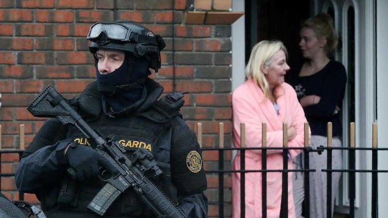 An armed Garda officer on patrol in Dublin. Picture by Niall Carson, Press Association              