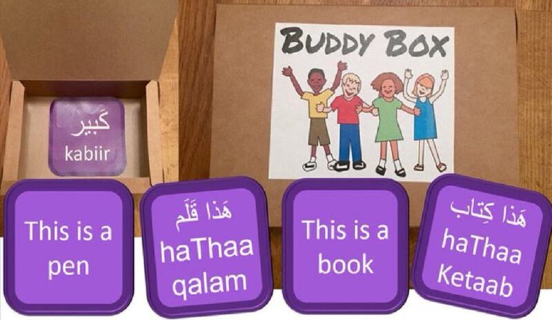 Cardboard box with purple cards inside