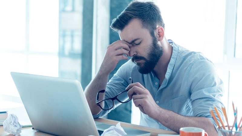 Generic photo of a man looking stressed at work (ThinkStock/PA)