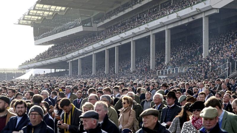 Crowds in the stands during day four of the Cheltenham Festival at Cheltenham Racecourse