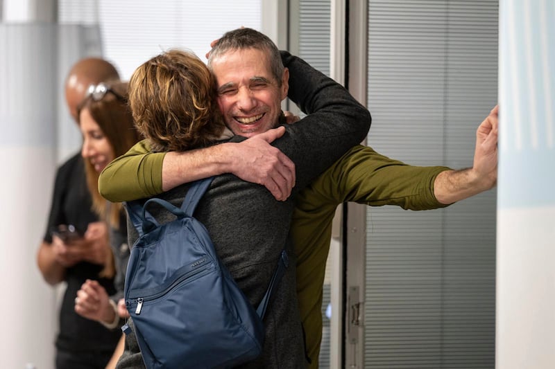 Hostage Fernando Simon Marman hugs a relative after being rescued from captivity in the Gaza Strip (Israeli Army via AP)
