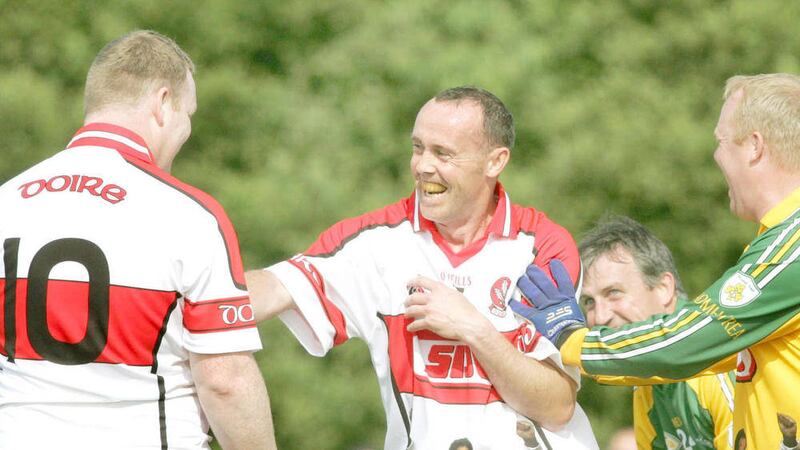 Gary Coleman enjoys a moment with Dermot Heaney and Benny Tierney at his father Eamonn's memorial match