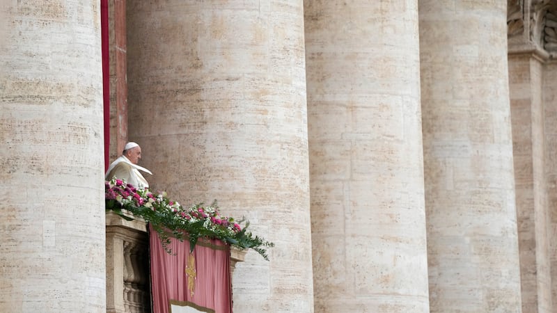 Pope Francis waves from the balcony of the St Peter’s Basilica prior to his speech (Alessandra Tarantino/AP)