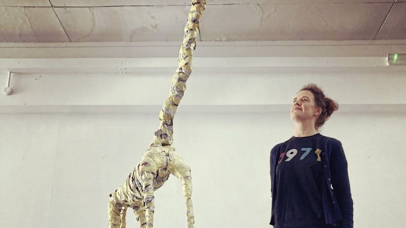 Artist Cathy Hart with her baby giraffe sculpture 