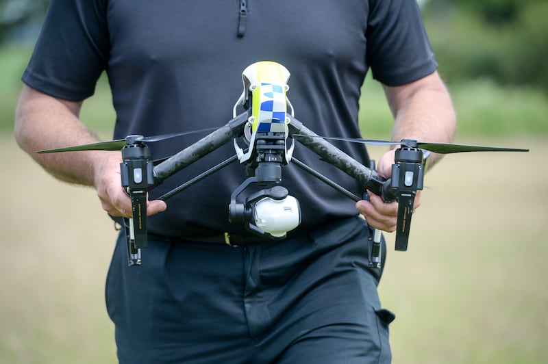 The drone in the hands of an officer