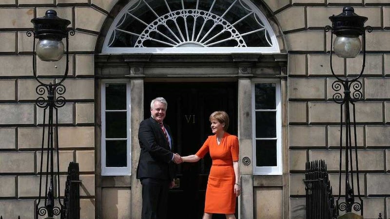 First Minister Nicola Sturgeon greets Carwyn Jones, First Minister of Wales as he he arrives at Bute House in Edinburgh for talks. Andrew Milligan/PA Wire