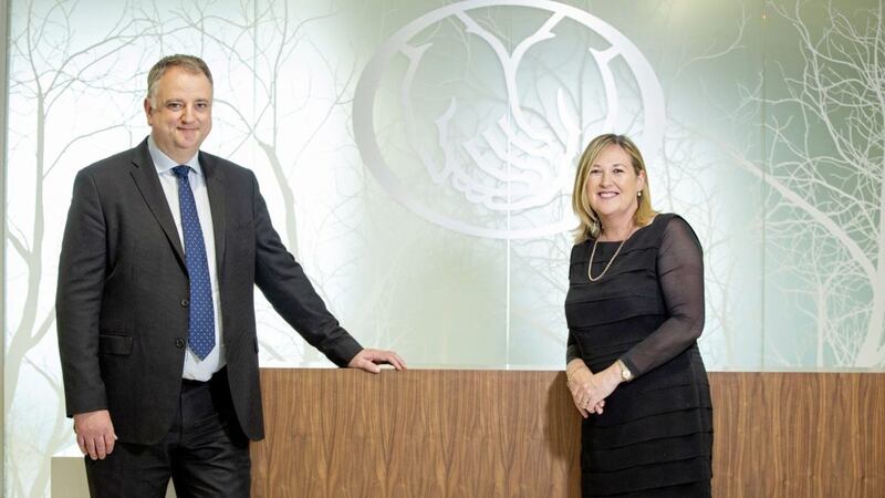 Allstate NI&#39;s managing director John Healy with Women in Business chief executive Roseann Kelly 
