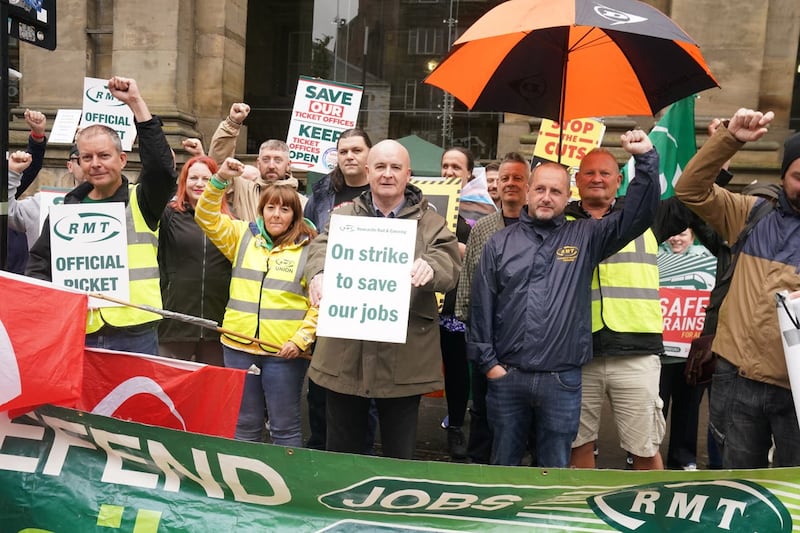 RMT general secretary Mick Lynch, centre, joins the picket line outside Newcastle Central station 