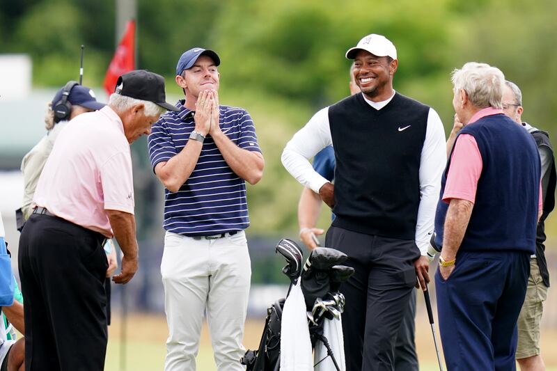 McIlroy, second left, and Woods, third left, are part of a seven-member transaction subcommittee created by the PGA Tour