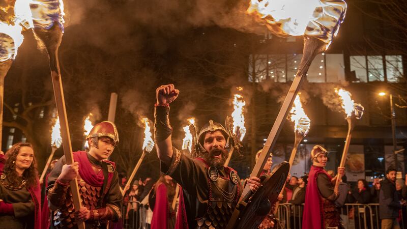 Vikings from the Shetland South Mainland Up Helly Aa Jarl Squad lead the torchlight procession through Edinburgh city centre, the opening event for the Hogmanay celebrations. Picture date: Friday December 29, 2023.