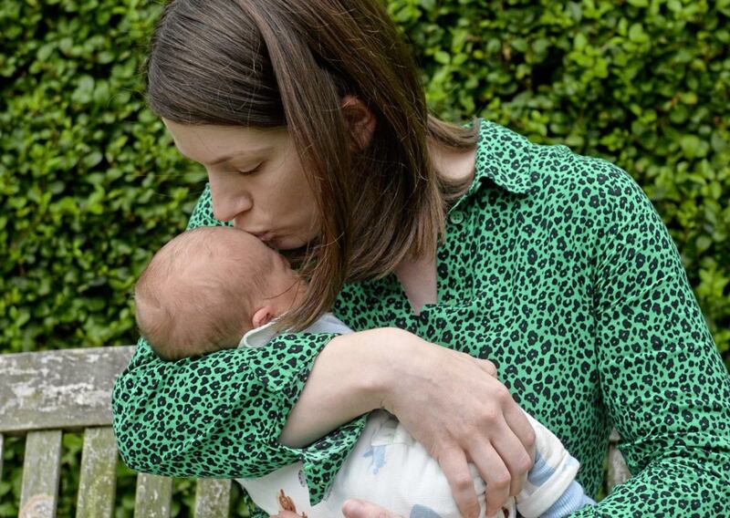 Medbh Hillyard at home with her two-week-old son, Rowan. Picture Mark Marlow
