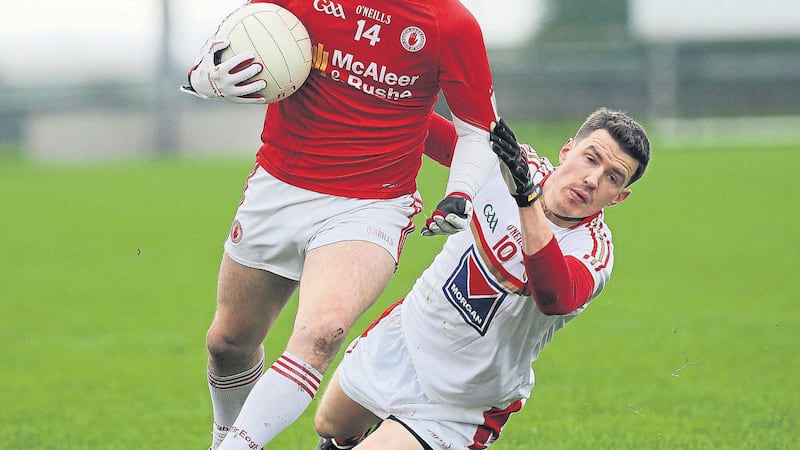 Tyrone&rsquo;s Lee Brennan is challenged by Louth&rsquo;s Adrian Reid during Sunday&rsquo;s O Fiaich Cup final in Crossmaglen