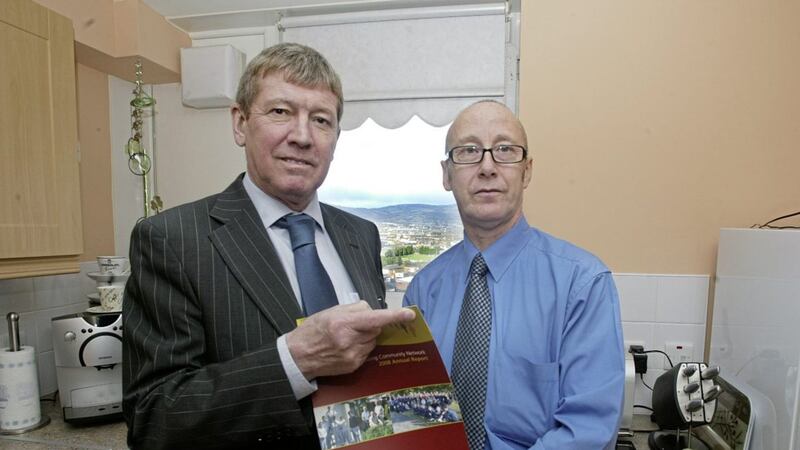 Former Housing Executive chief executive Paddy McIntyre pictured with community stalwart John Leathem in Divis Tower in 2009. 