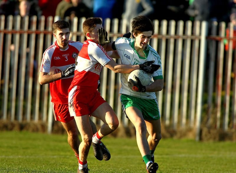 Burren's Declan Murdock comes under pressure from Kilrea's Shea Madden and Gear&oacute;id McLaughlin during Sunday's final <br />Picture by S&eacute;amus Loughran