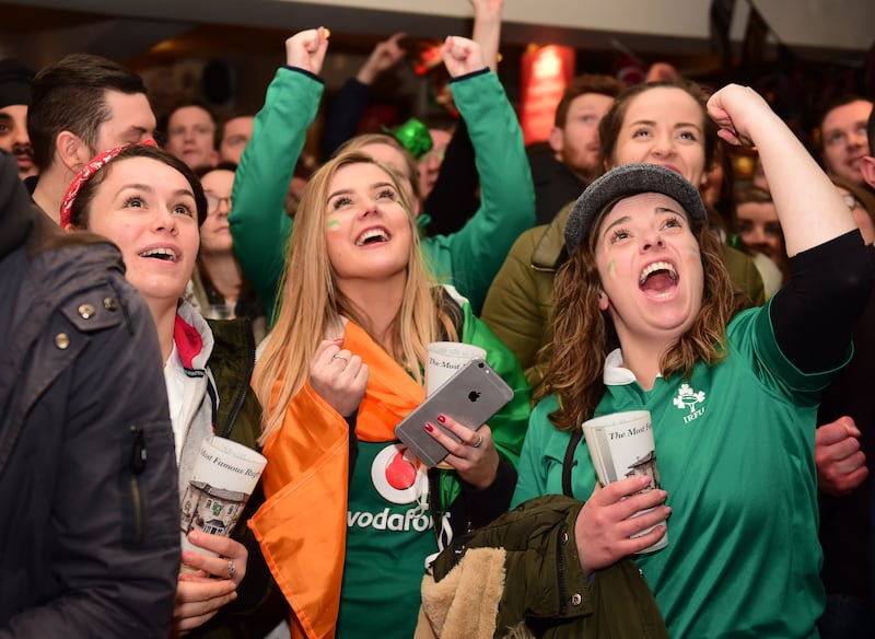 English and Irish fans in the Cabbage Patch pub in Twickenham, London watch the first half of the Six Nations rugby match between Ireland and England