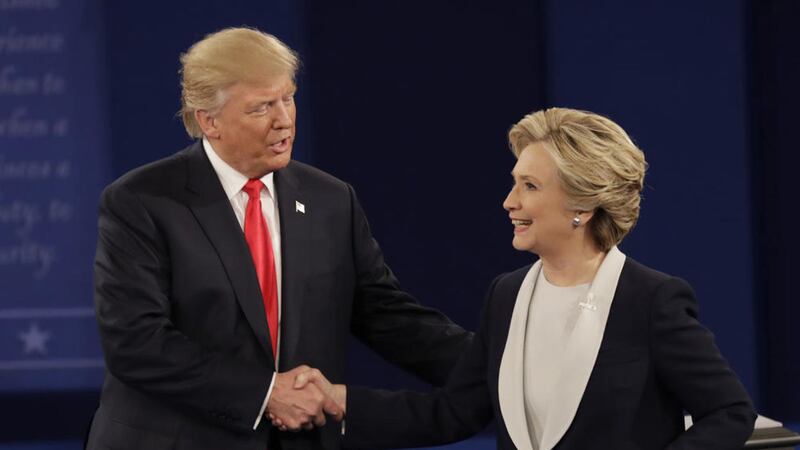 Republican presidential nominee Donald Trump shakes hands with Democratic presidential nominee Hillary Clinton following the second presidential debate at Washington University in St Louis on Sunday PICTURE: Patrick Semansky/AP