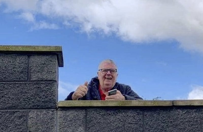 Lockdown was never going to stop Hugh from watching his beloved Derry City as he scaled a wall to watch their first home game in July. Picture by Billy Scampton 