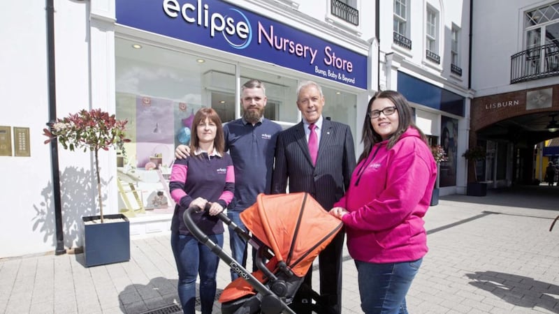 Eclipse Nursery Store owners Patrick and Claire Herald and staff member Victoria Edgar, and the Council&#39;s development committee chair Uel Mackin, celebrate the opening of the baby products company&#39;s new outlet in Lisburn Square 