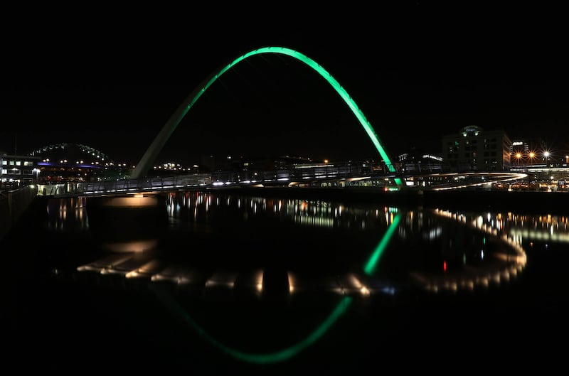Gateshead Millennium Bridge in Gateshead, Tyne and Wear, is lit green by Tourism Ireland to celebrate St Patrick's Day, which is on Friday 17th March&nbsp;
