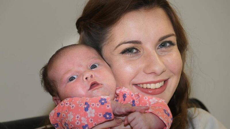 Katie Hughes and her five-week-old daughter Ruby, who had tongue-tie at birth 