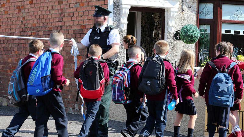 Pupils from St Paul's Primary School in Mica Drive, Beechmount were evacuated after a suspect package was found in a nearby alley. Picture by Mal McCann