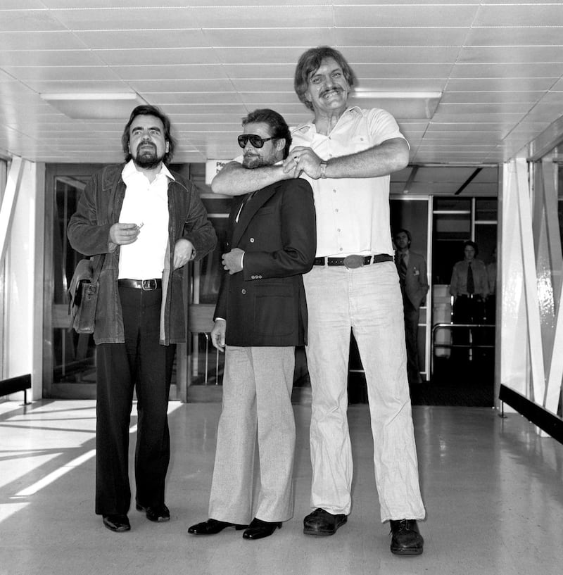 Actors Michael Lonsdale, Roger Moore and Richard Kiel, aka Hugo Drax, James Bond and Jaws, at London’s Heathrow Airport (PA)