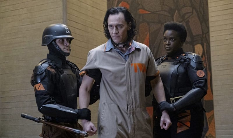 Loki: Tom Hiddleston as Loki and Wunmi Mosaku as Hunter B-15 