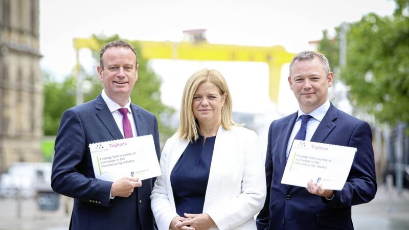 Manufacturing NI chief executive Stephen Kelly, Maureen Treacy from Perceptive Insight and Tughans partner James Donnelly pictured pre-Covid-19 