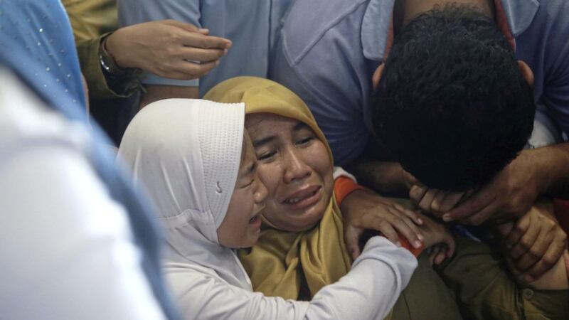Relatives of passengers comfort each other as they wait for news on a Lion Air plane that crashed off Java Island at Depati Amir Airport in Pangkal Pinang, Indonesia Picture by Hadi Sutrisno/AP 
