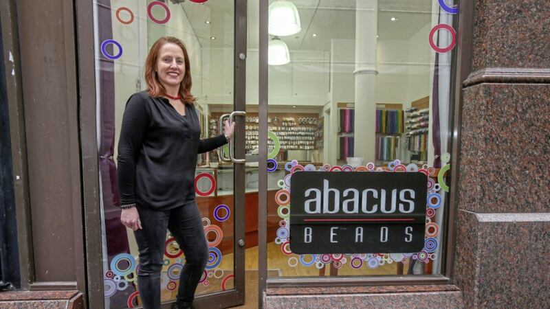 Kathleen McGovern, who owns Abacus Beads, back in her shop as a new walk way was opened in Castle Street. Picture by Mal McCann 