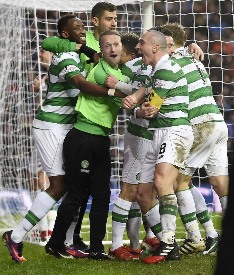 Celtic players Moussa Dembele, Leigh Griffiths and Scott Brown mob Scott Sinclair (hidden) after he scored the winning goal during the Ladbrokes Scottish Premiership match at Ibrox Stadium,&nbsp;