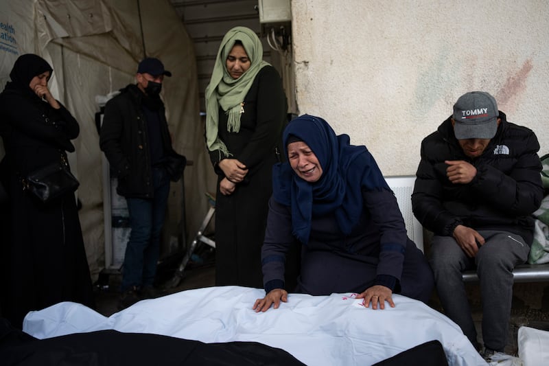 Palestinians mourn relatives killed in the Israeli bombardment in Rafah, Gaza Strip, Saturday, Feb.10, 2024. (AP Photo/Fatima Shbair)