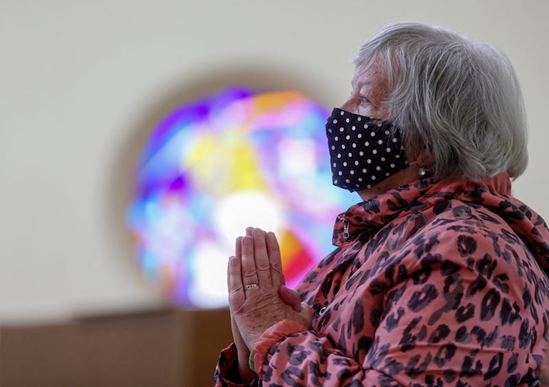 &nbsp;A woman prays in Corpus Christi Church in Ballymurphy, west Belfast today. Picture by Mal McCann