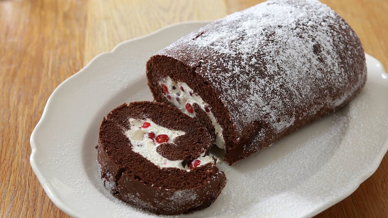 Delicious chocolate roulade with cream and redcurrants