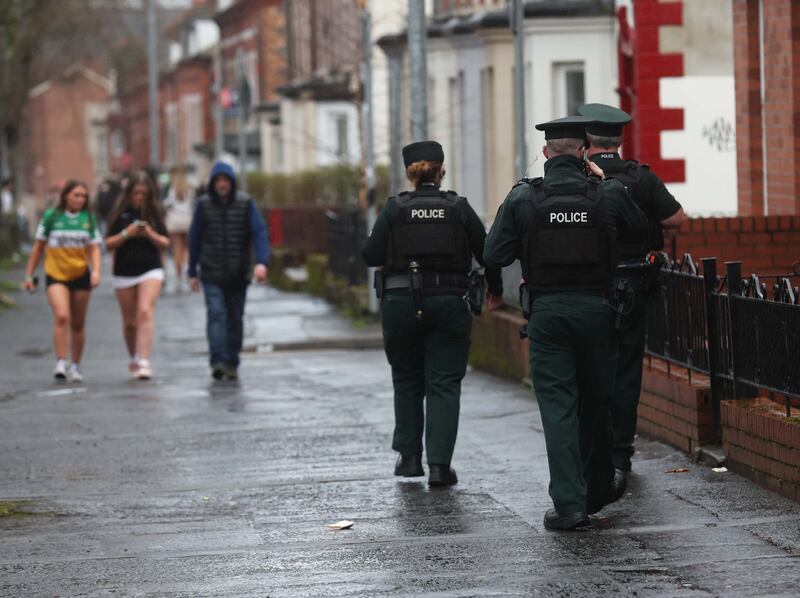Police and Student safety officers patrol the Holylands area of Belfast on St Patrick’s day.
PICTURE COLM LENAGHAN